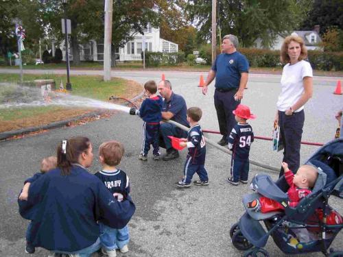 Children using fire hose